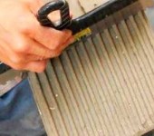 Remove excess with a notched trowel