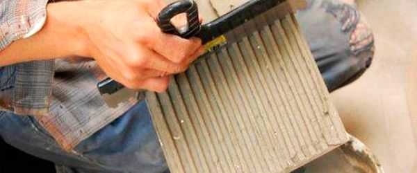 Remove excess with a notched trowel