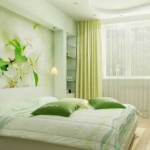 Bedroom in soft green tones, repeated in the photo wallpaper