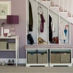 A wardrobe under the stairs is a great way out in a small hallway