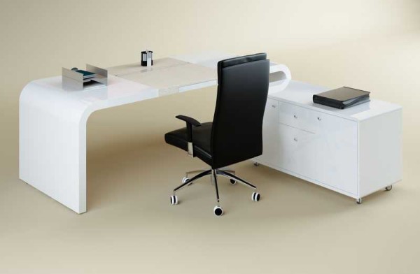 The table in the shape of the letter L is convenient: you can place a large number of necessary equipment or documents