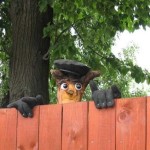 Figurine on a wooden fence))