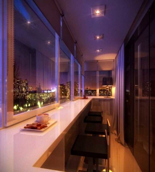 It is not difficult to make a dining area on a balcony or loggia - a wide window sill under the glazing frames, high chairs, appropriate lighting