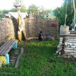 The wattle fence is a good fence, and the style supports the design of the well