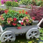 Trolleys and wooden wheels - traditional elements of a country-style garden