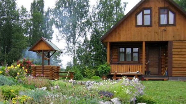 It is better to arrange a well in the same style as the house.