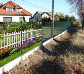 A photo grid for a fence covers the transparent fence, making it almost opaque