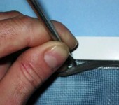 You can pry off the sealing cord with a screwdriver