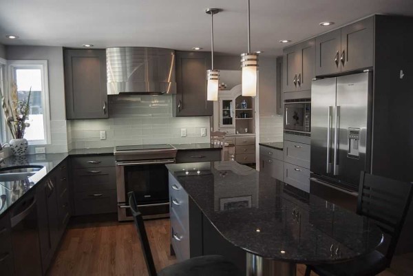In a wide kitchen, a U-shaped layout is convenient because you can put a dining table in the center