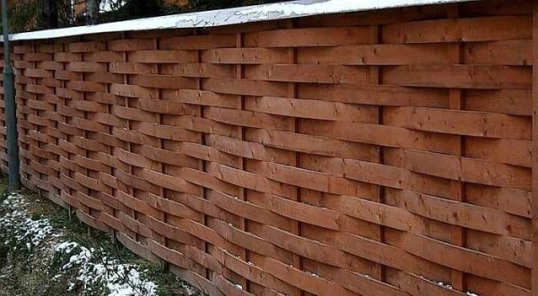 This is a wicker fence made of boards