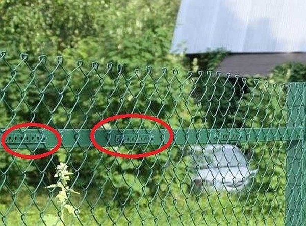 Another way to attach the chain-link to metal posts