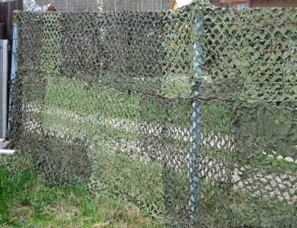 A masking net on the fence significantly reduces the visibility of the site