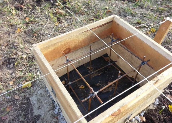 It looks like a formwork under a post and reinforcement