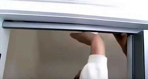 Installing an accordion door in a doorway