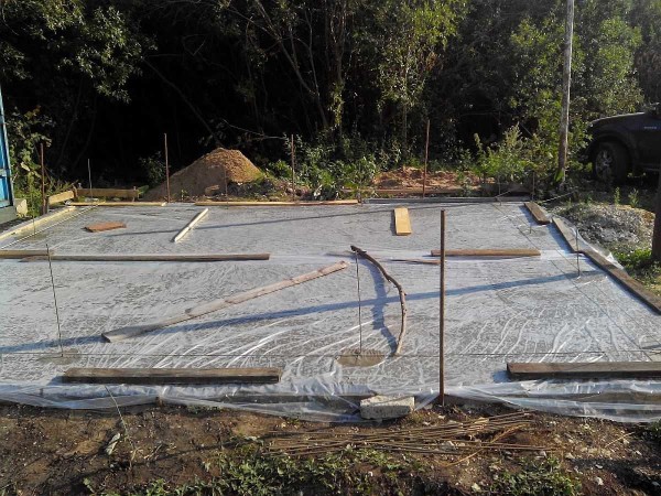 After pouring, the monolithic slab is covered with a film