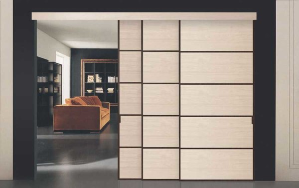 Cascading sliding doors: one leaf pulls the other