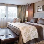 Bedroom in a modern style, dominated by brown colors