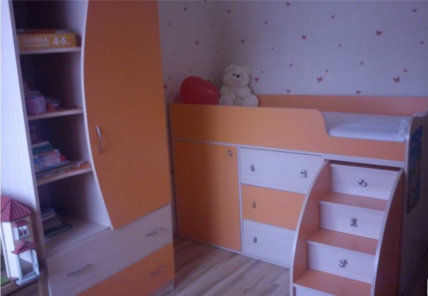 A children's loft bed can be of medium height - the sleeping place is located at a distance of a meter from the floor (or so)