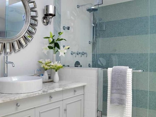 An unusual mirror in the bathroom sets the tone for the entire design