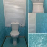 The walls in the toilet are finished with decorative plaster