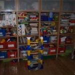 Gradually, one rack turns into a wall with toys