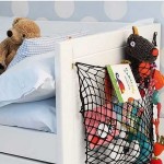 Favorite toys can be stored in a net on the headboard