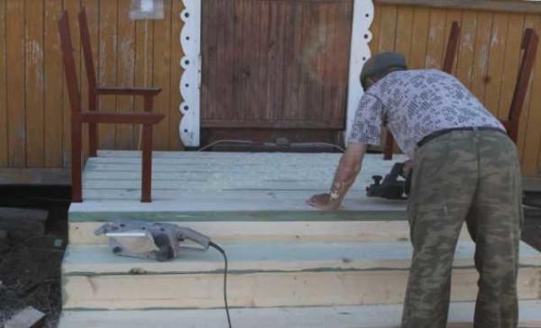 Sanding the surface of the boards for an acceptable smoothness