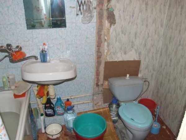 Wall between toilet and bathroom removed