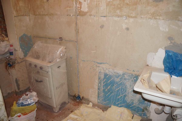 Removing all the old finish to the bare wall