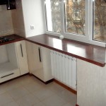 The space under the windowsill is occupied by a wardrobe