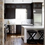 A very unusual location of the kitchen unit - on the wall with a window