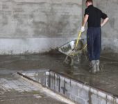 It takes a big team to mix concrete in a concrete mixer