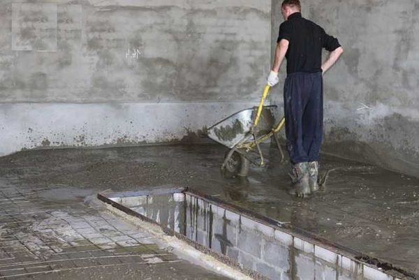 It takes a big team to mix concrete in a concrete mixer