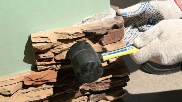 For better adhesion of the stone to the wall, you can use a rubber hammer