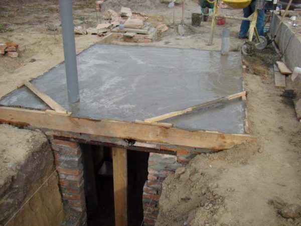 It looks like a flooded floor slab for a cellar