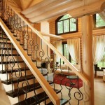 Wooden staircase with forging elements