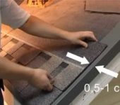 The tiles on the pediment are cut, stepping back 1 cm from the ledge of the pediment bar