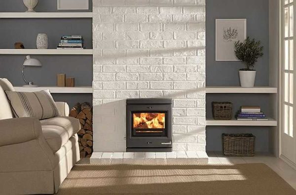 There are two options to achieve this effect - paint an existing brick fireplace or cover with clinker tiles.