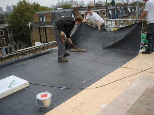 Roll roofing made of material with a self-adhesive layer
