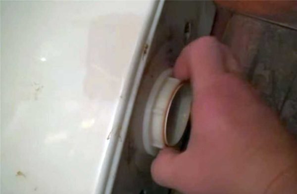 Unscrew the nut holding the drain mechanism
