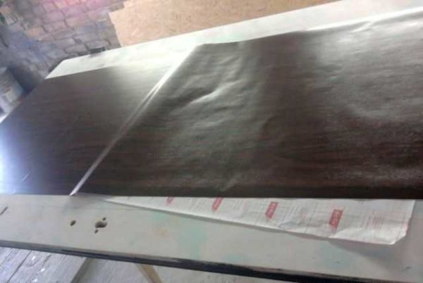 Gently glue the film