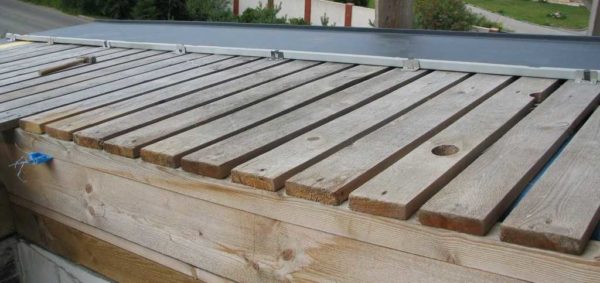 Installation of clamps for standing seam roofs