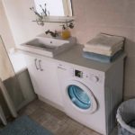 Place the washing machine next to the sink
