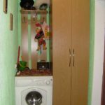 In the photo - the option of installing a washing machine in a narrow corridor