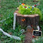 Design an outdoor garden pot as a house for fairies
