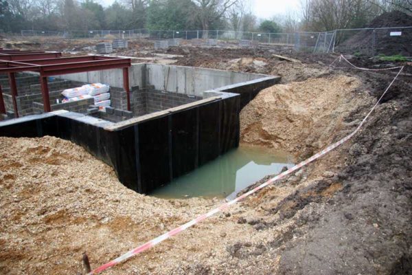 With a high ground level, strip foundations are also made, but waterproofing should be at a height