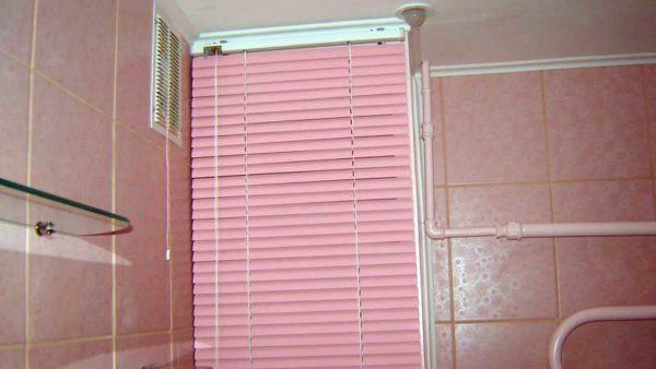 Wall-mounted blinds are an inexpensive way to hide pipes