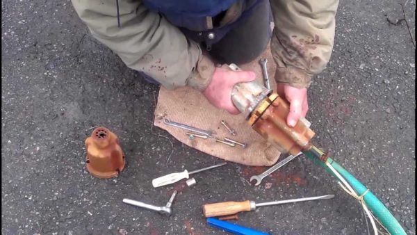 Tie with plastic, nylon cords, adhesive tape, but not metal (even in a sheath)