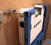 Fastening the installation frame to the wall