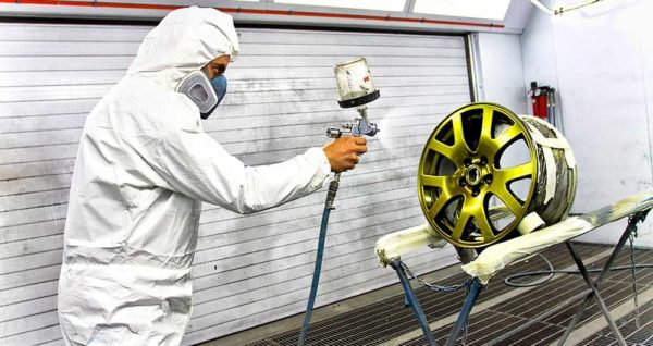 The process of applying powder paint to a part, and then firing until polymerization